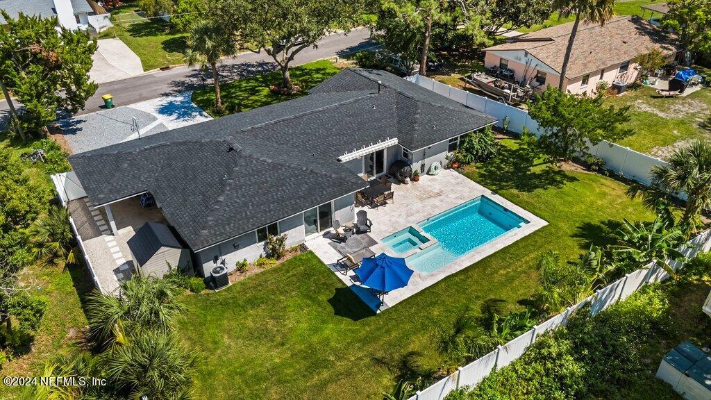 an aerial view of house with yard