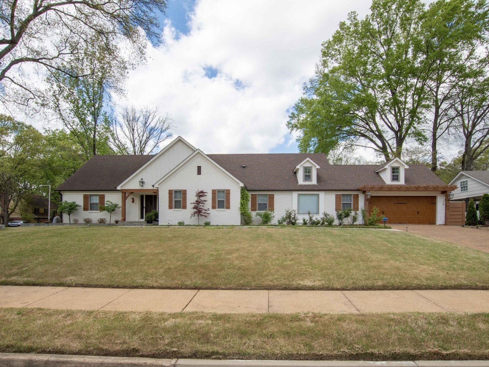 front view of a house with a yard