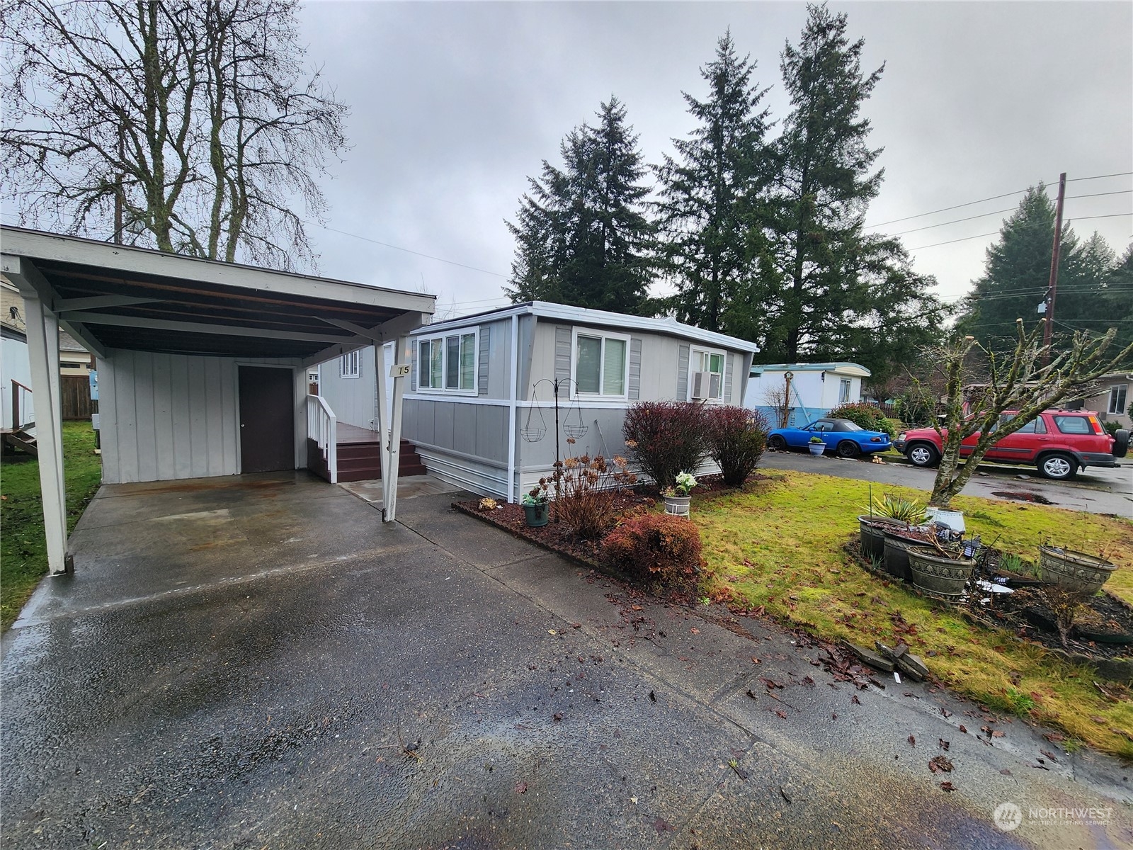 a view of a house with a yard and garage