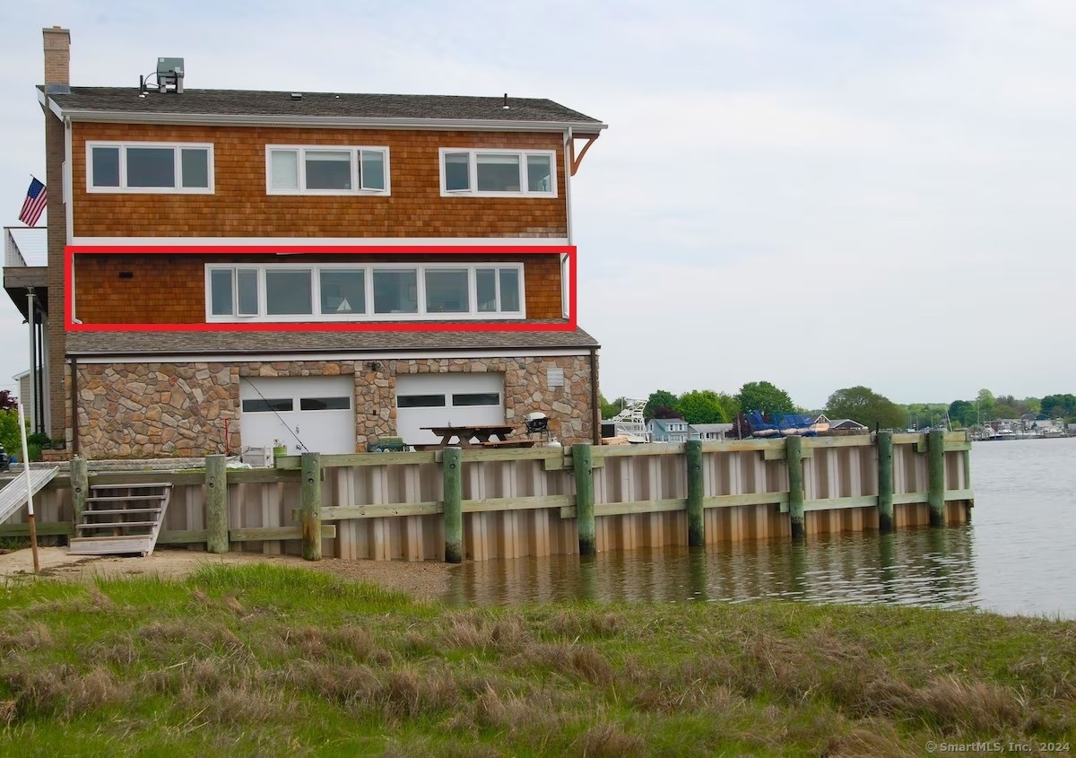 a house with swimming pool in front of it