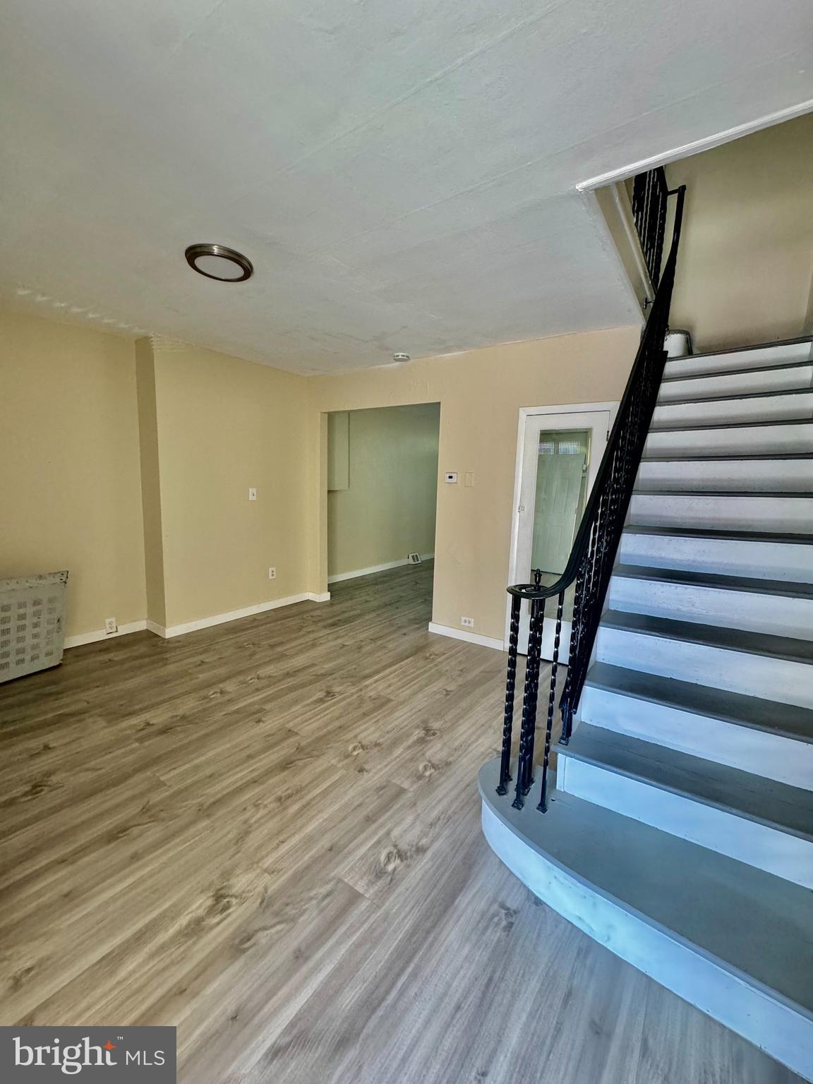 a view of an entryway with wooden floor