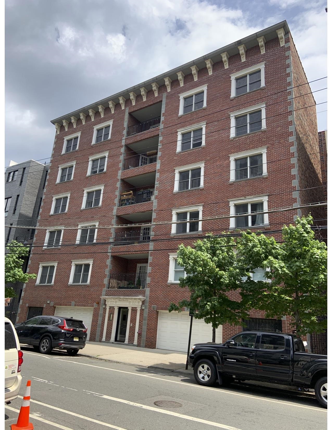 a front view of a building with street view