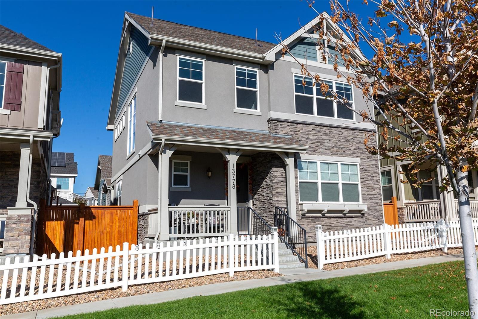 front view of a house with a small yard