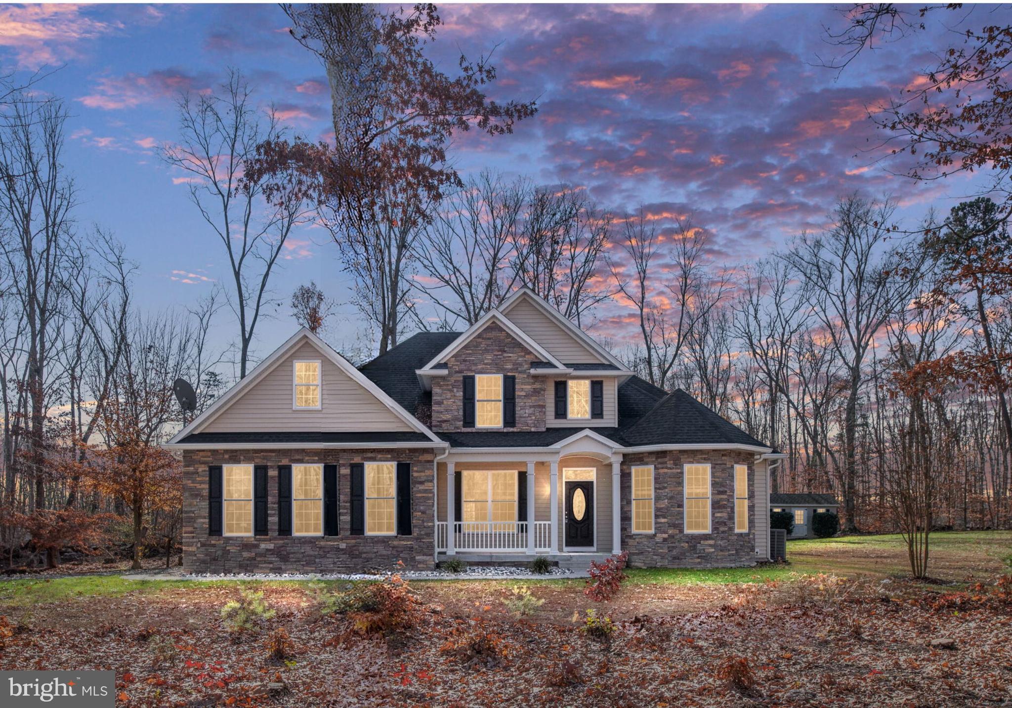 front view of a house with a yard