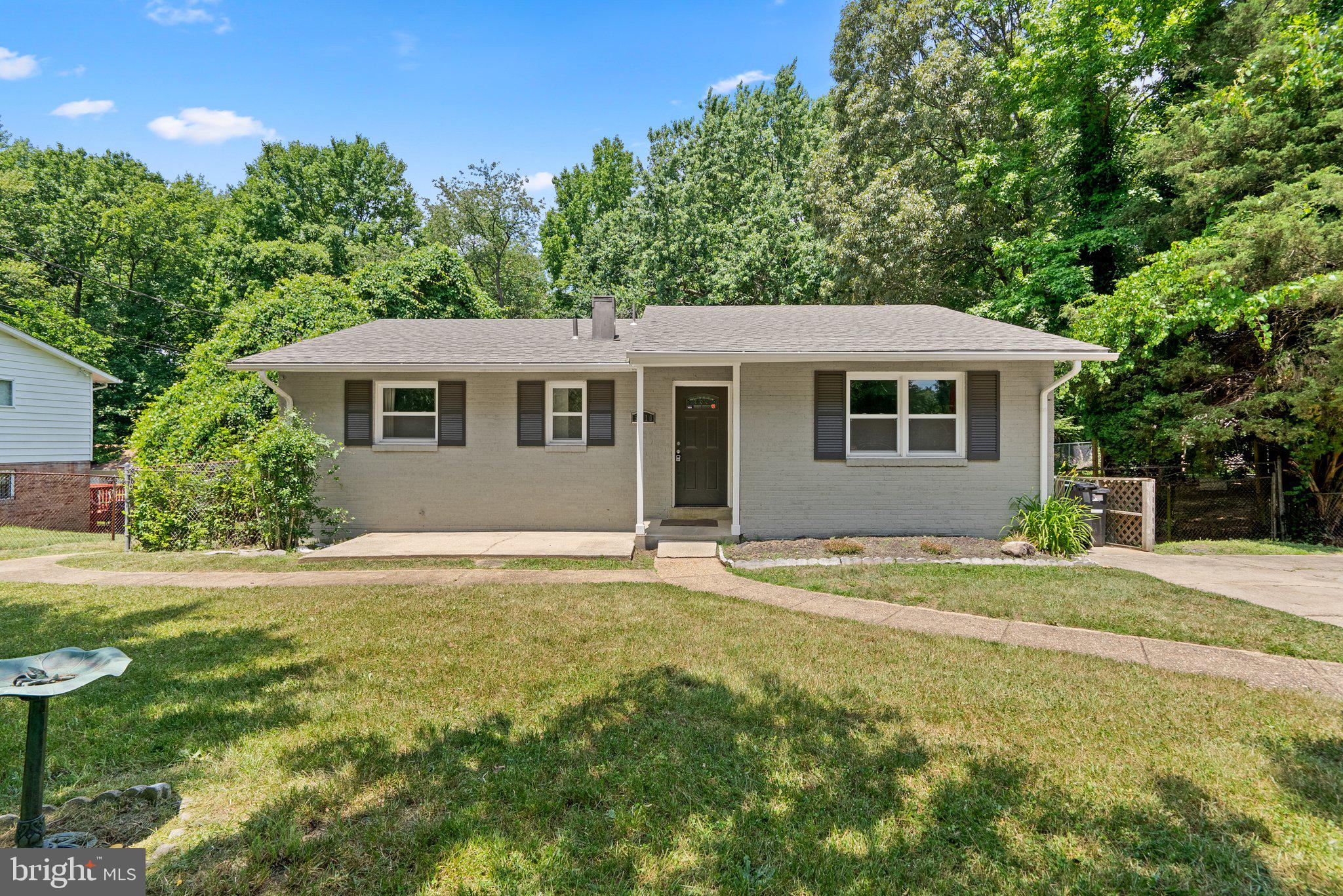 a house with yard in front of it