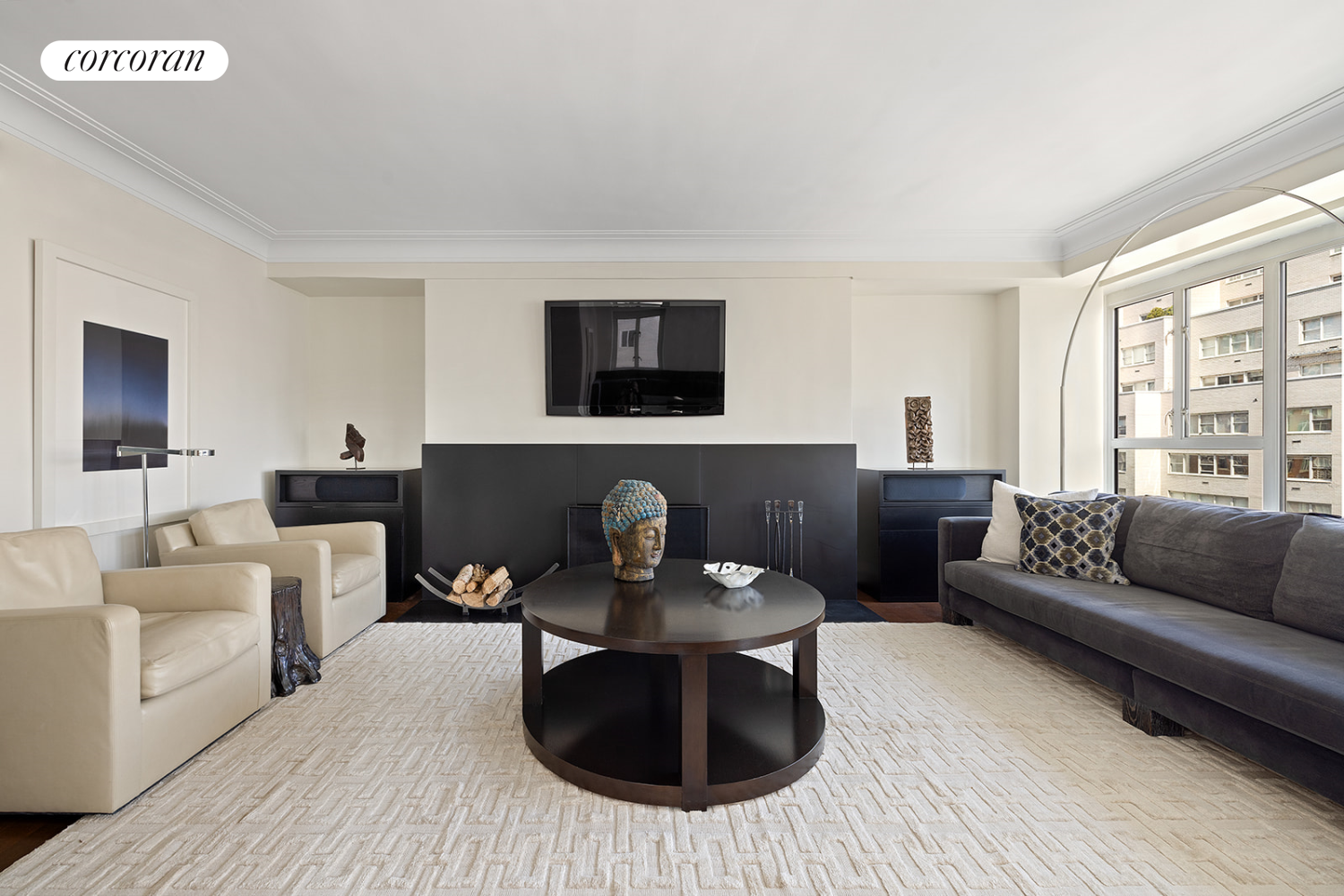 a living room with furniture a fireplace and a flat screen tv