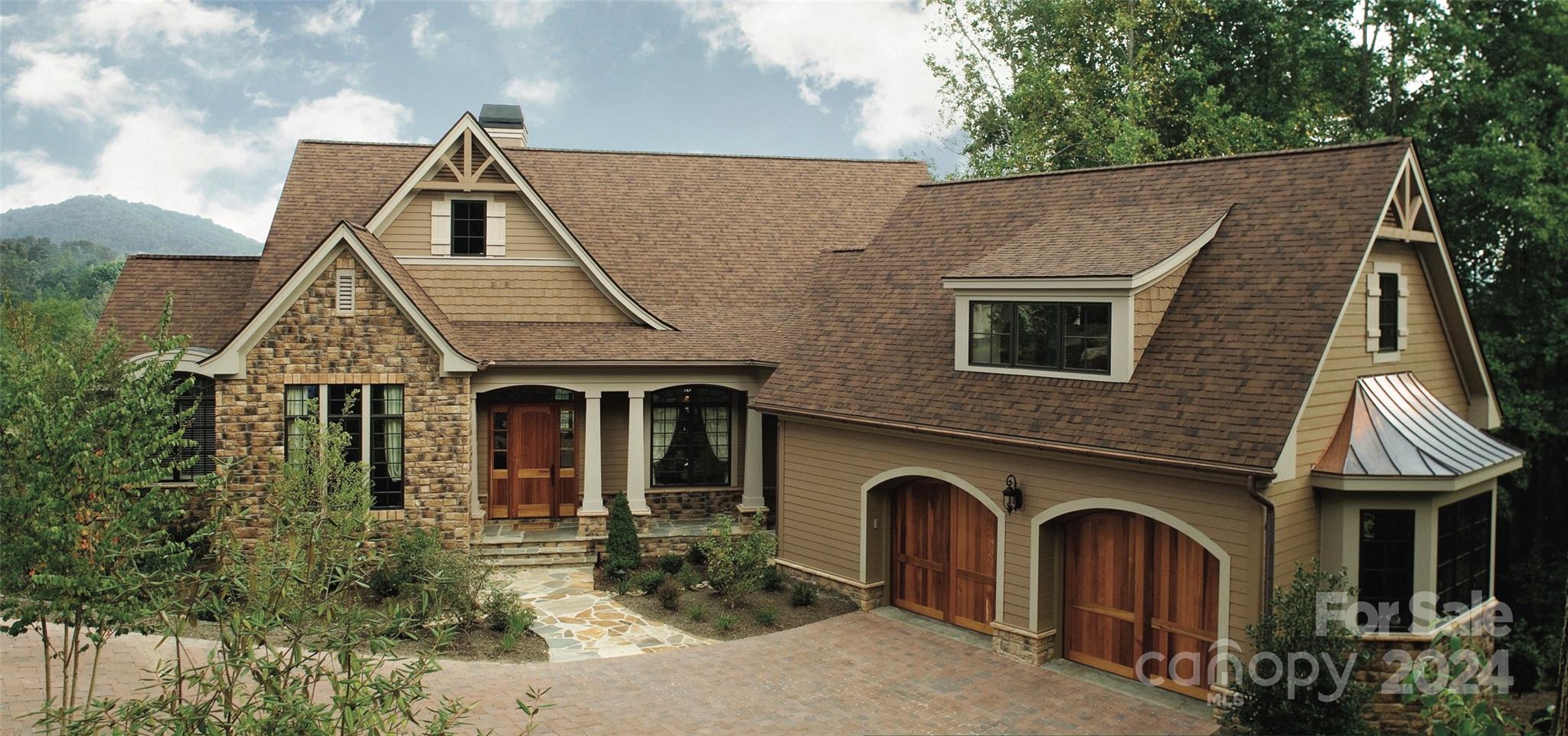 a front view of a house with garden