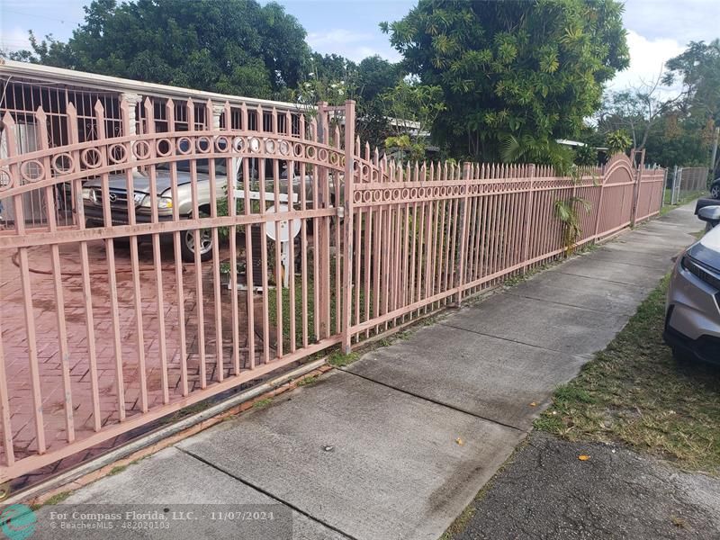 a view of a balcony with wooden fence