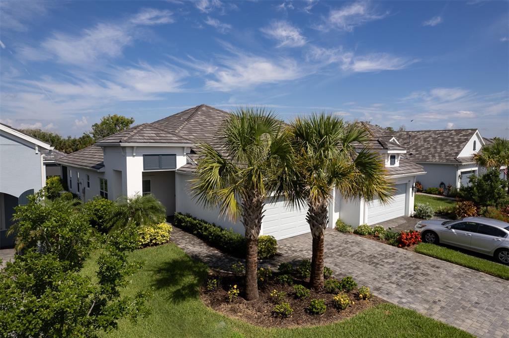 a front view of a house with garden