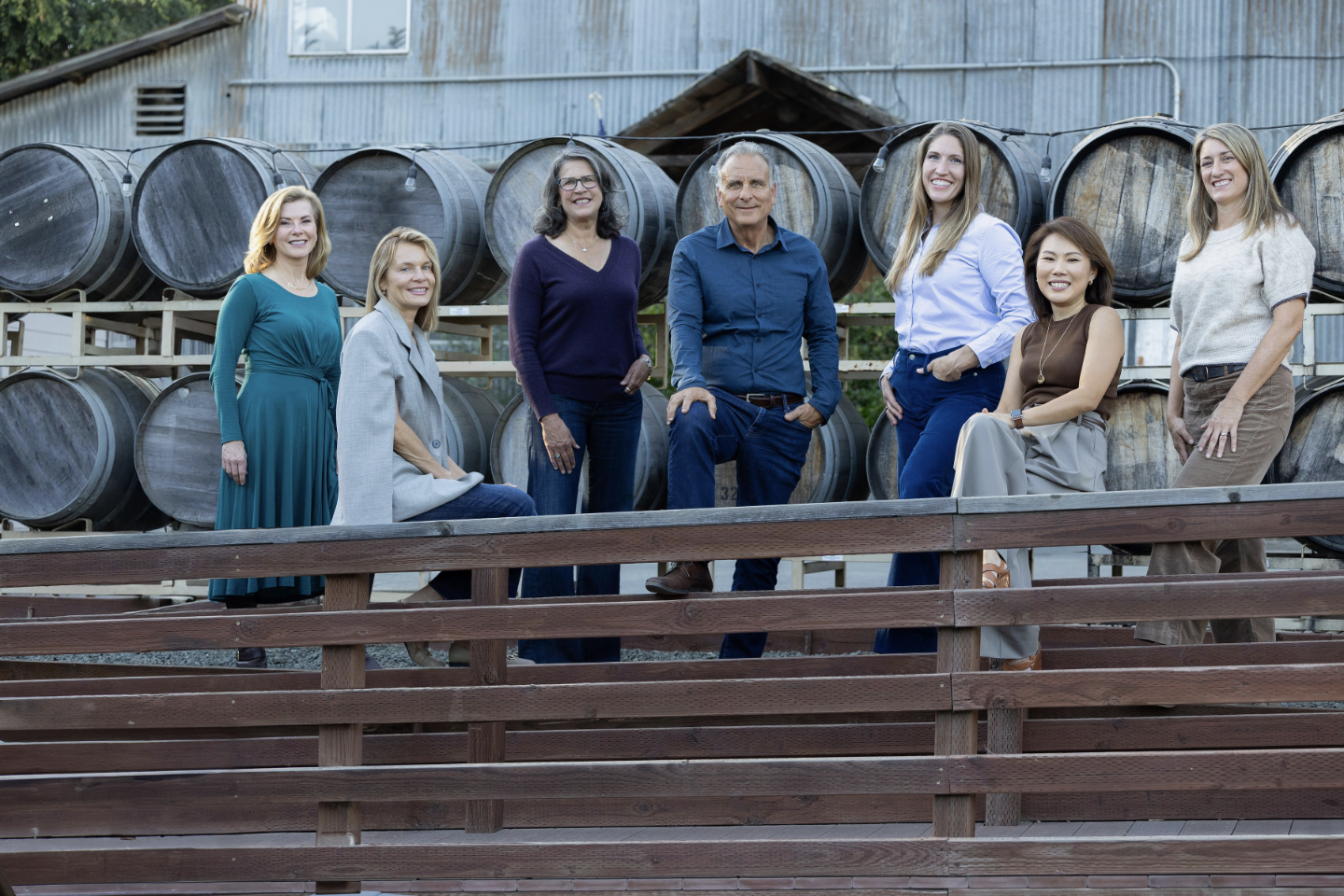 A group of people standing by barrels