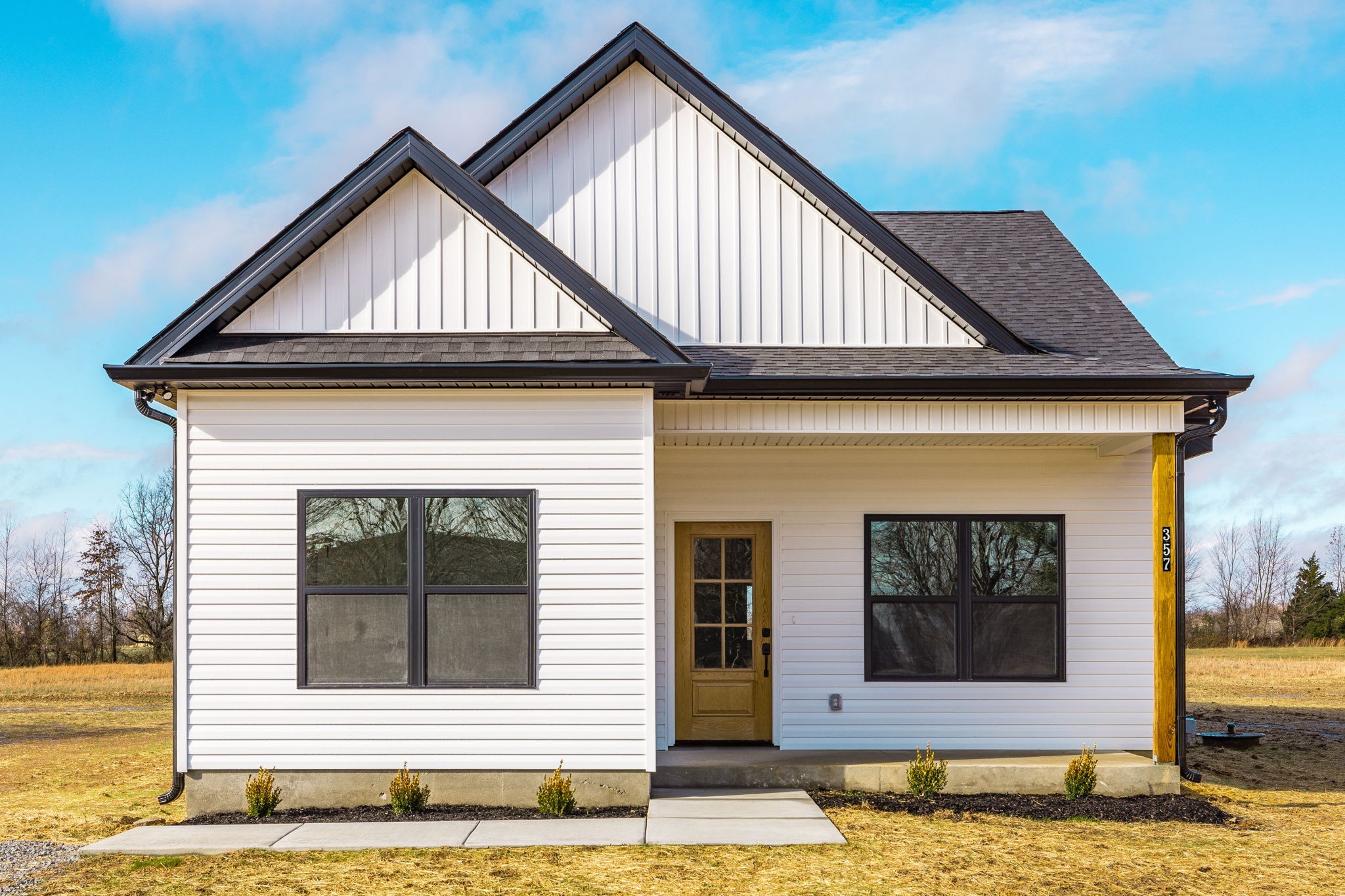 a front view of a house with a yard