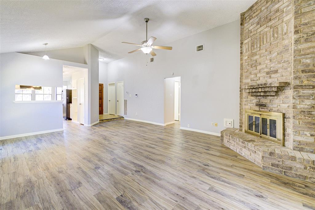 a view of a livingroom with wooden floor