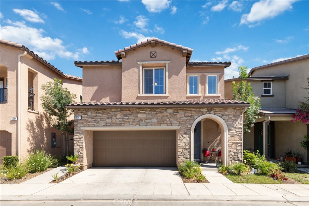 a front view of a house with yard