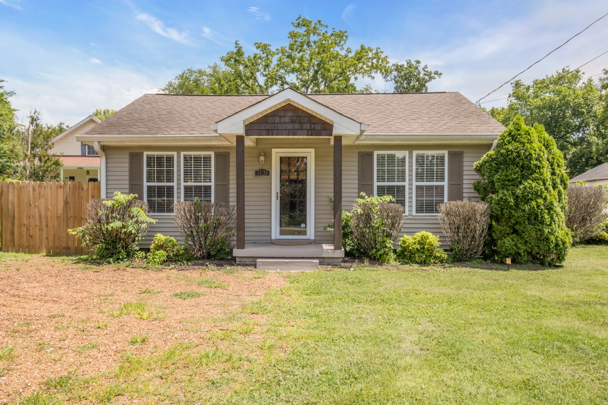 front view of a house with a yard