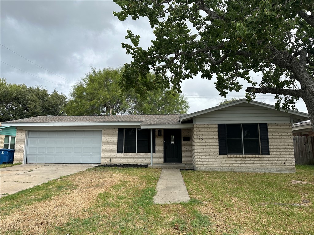 a front view of a house with a garage