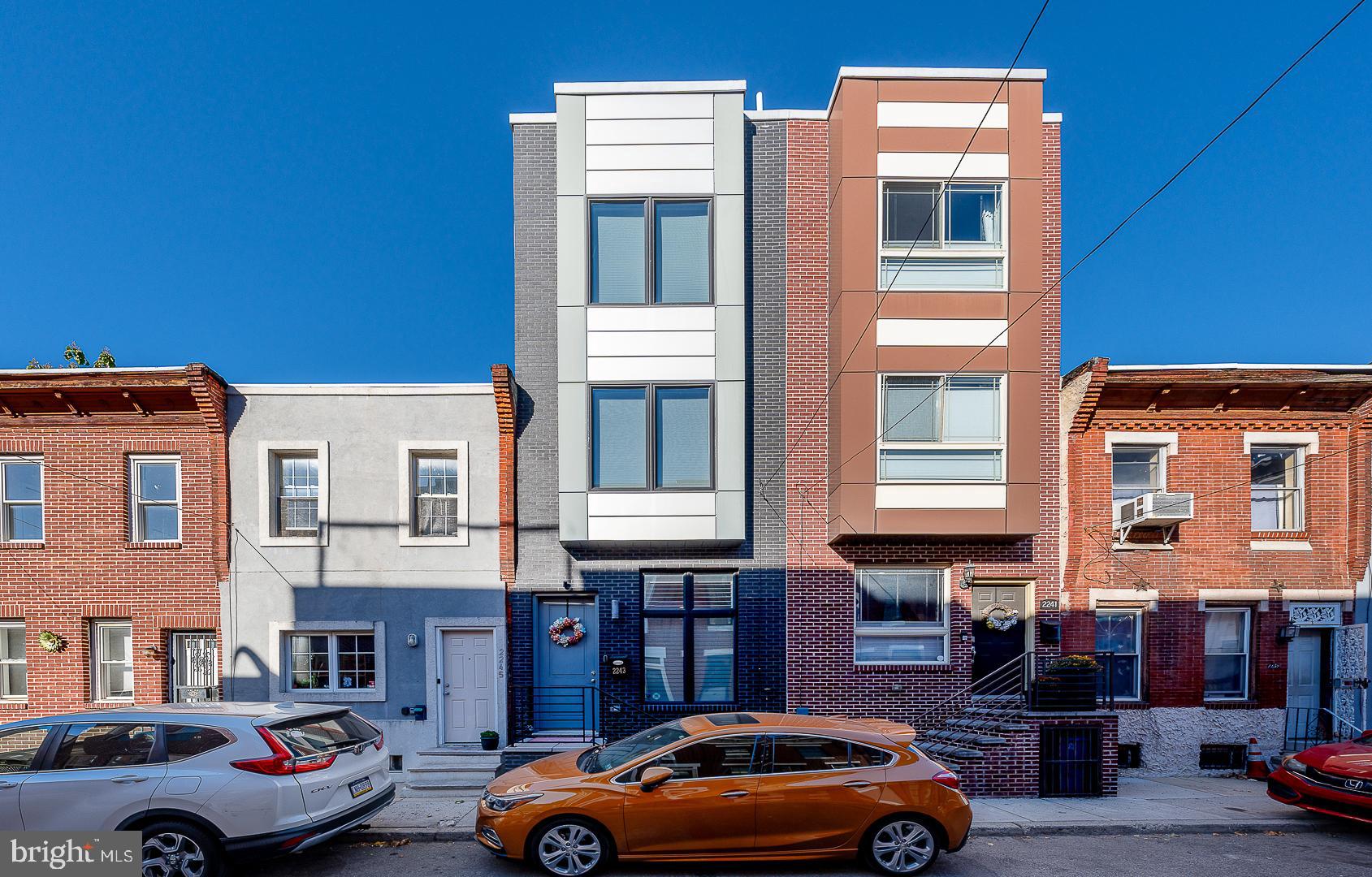 a front view of a building with parking space