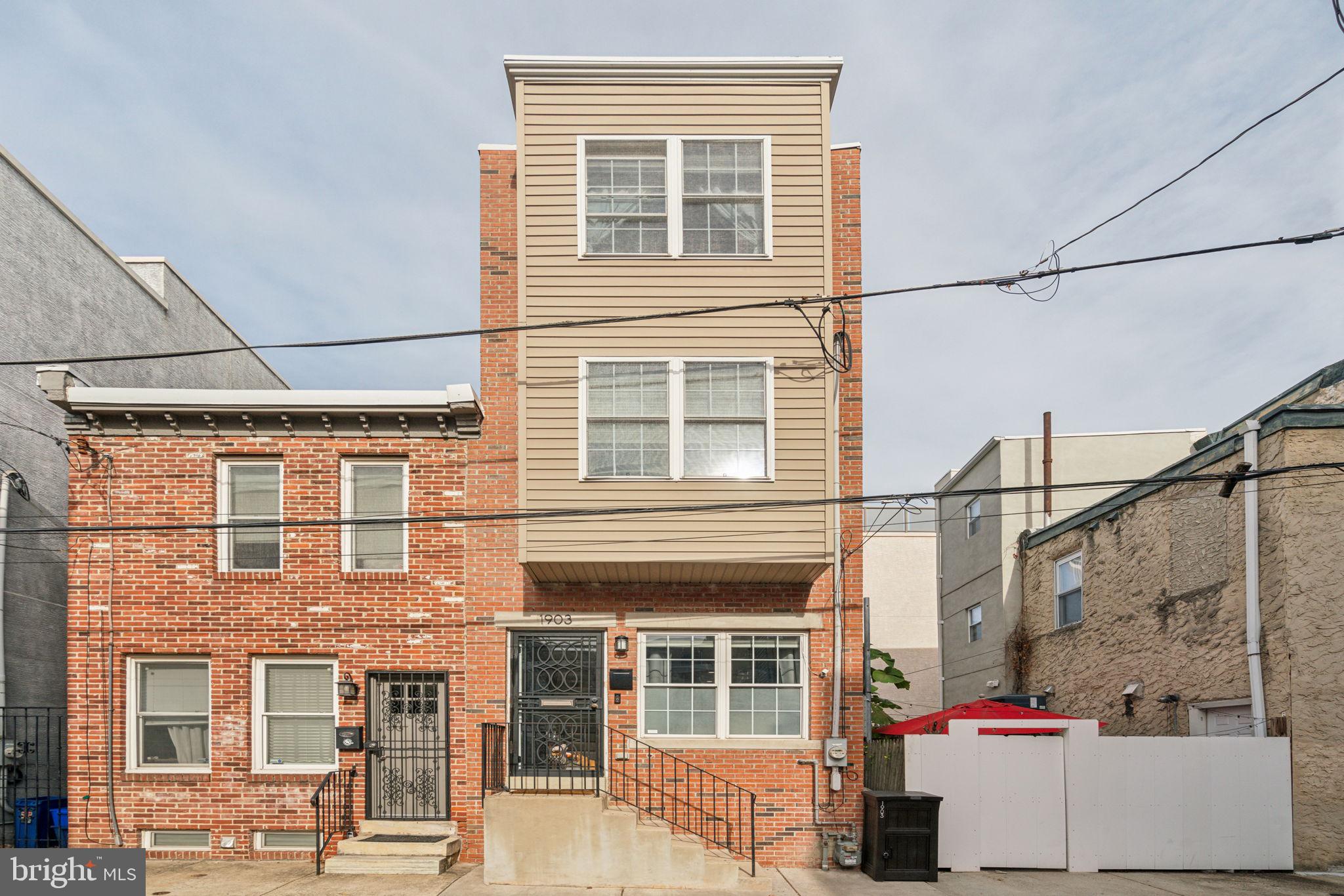 a view of a house with a window and brick walls