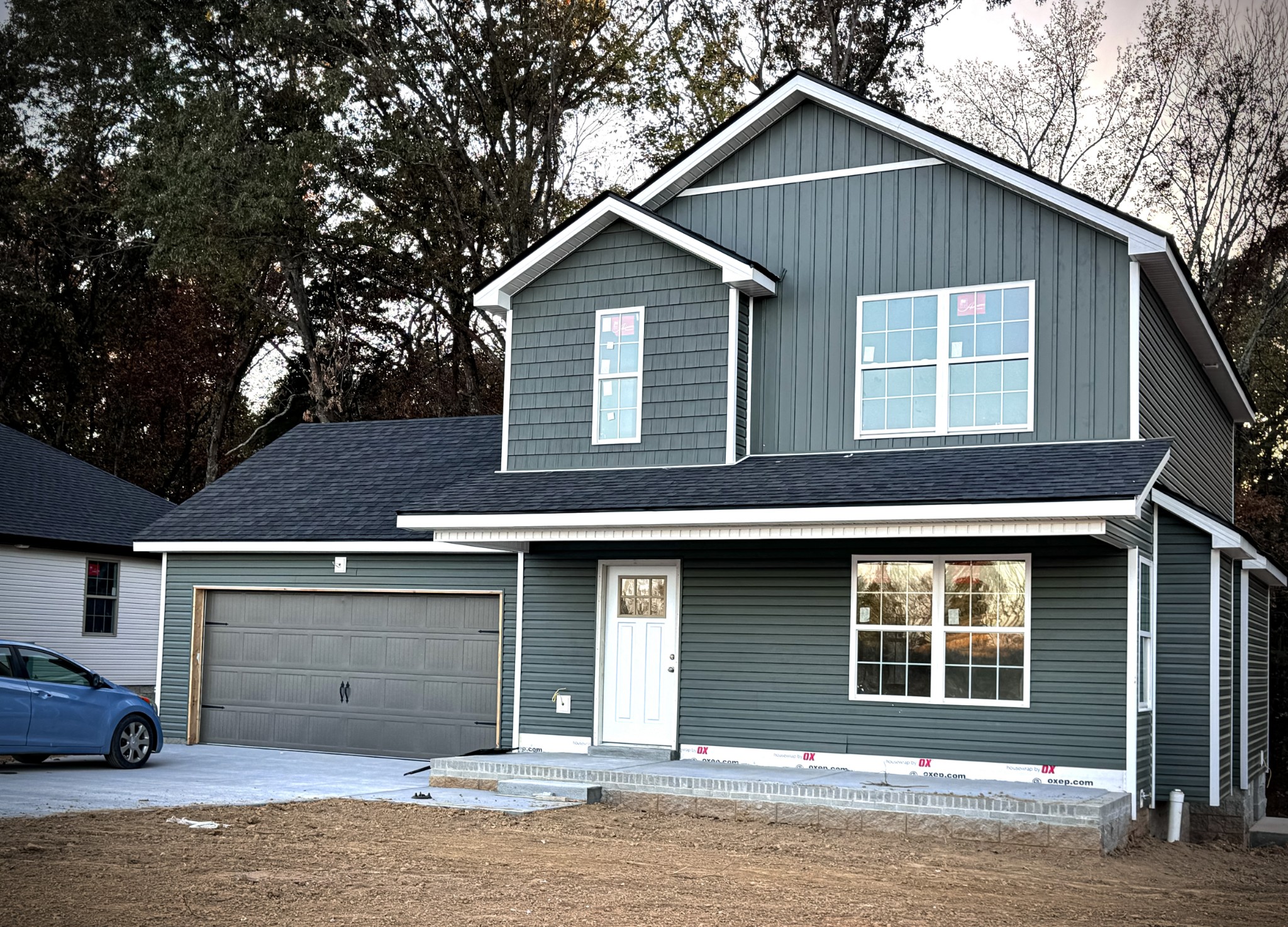 a front view of a house with garage