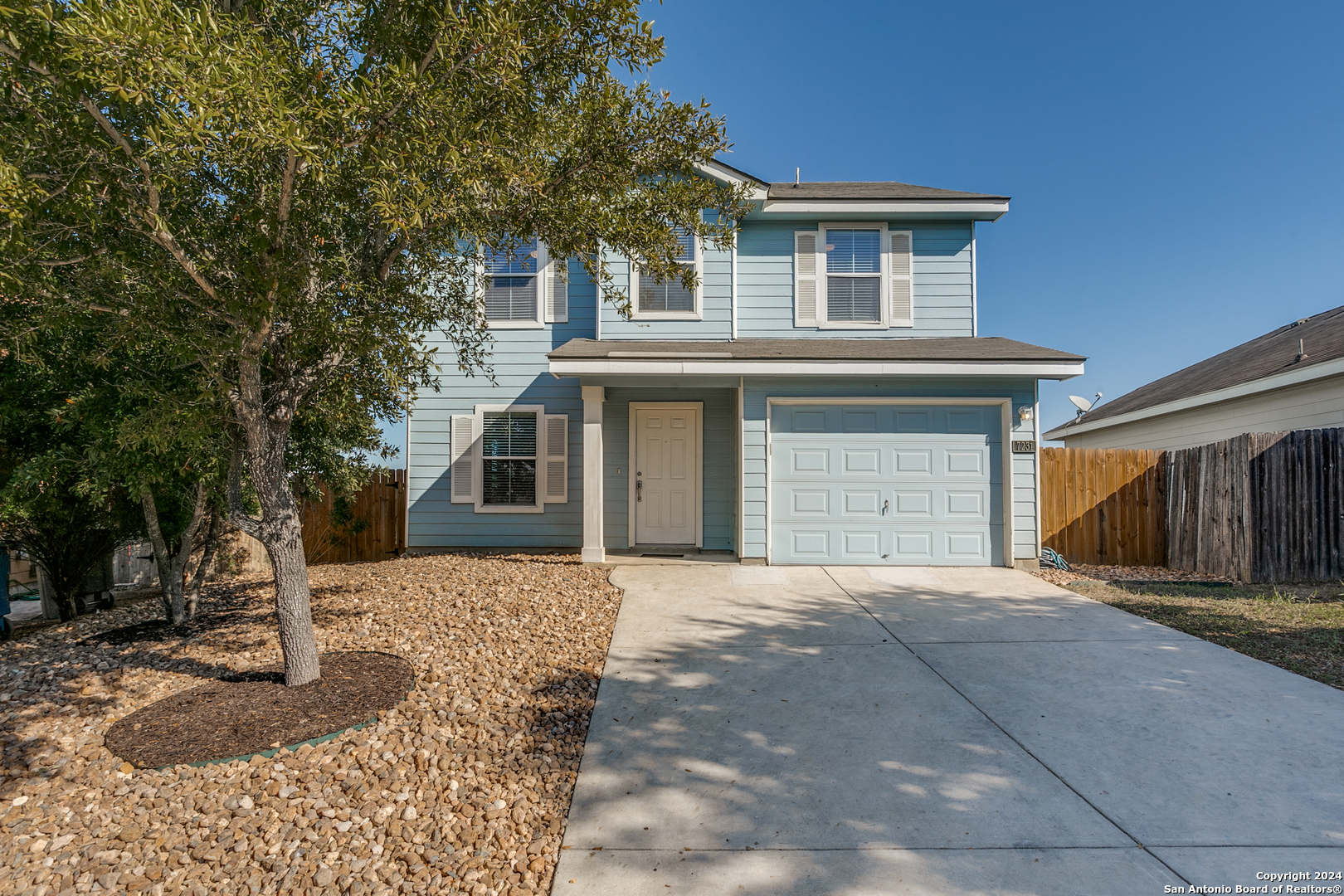 a front view of a house with a garage