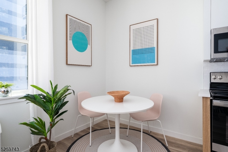 a flower room with a chair and a potted plant