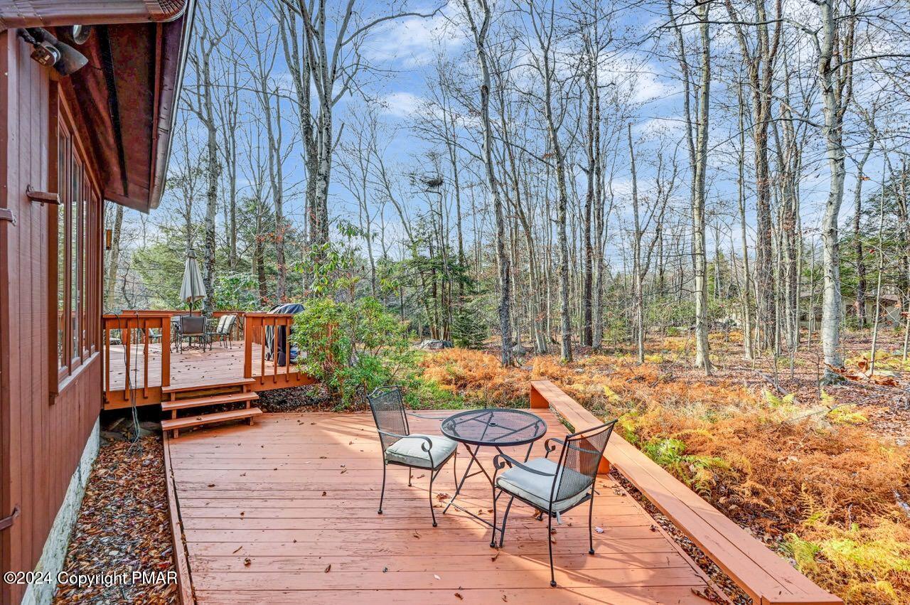 a view of a backyard with sitting area and furniture