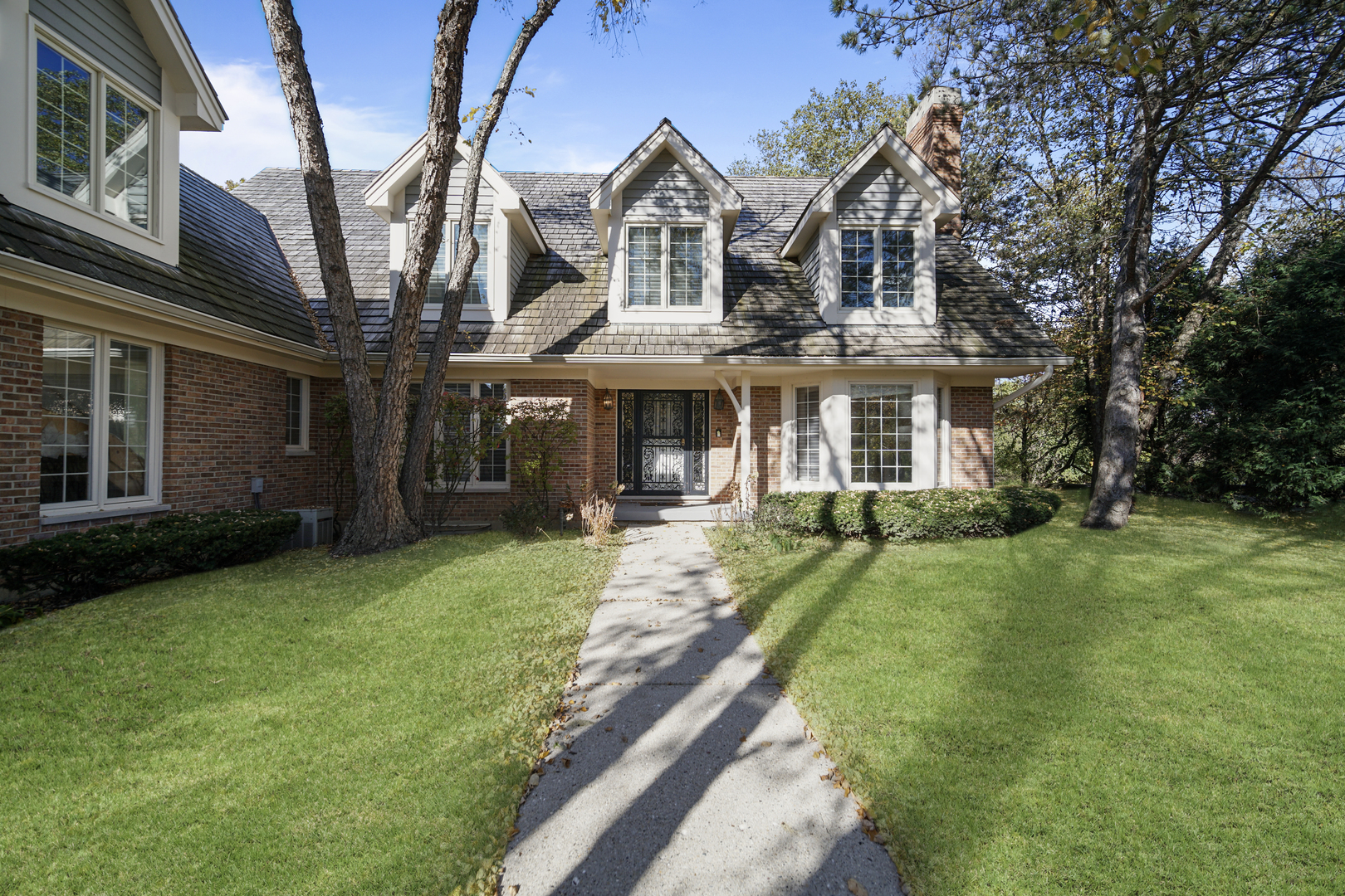 a front view of a house with a yard