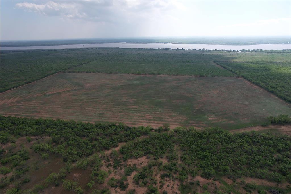 a view of a lake with a yard