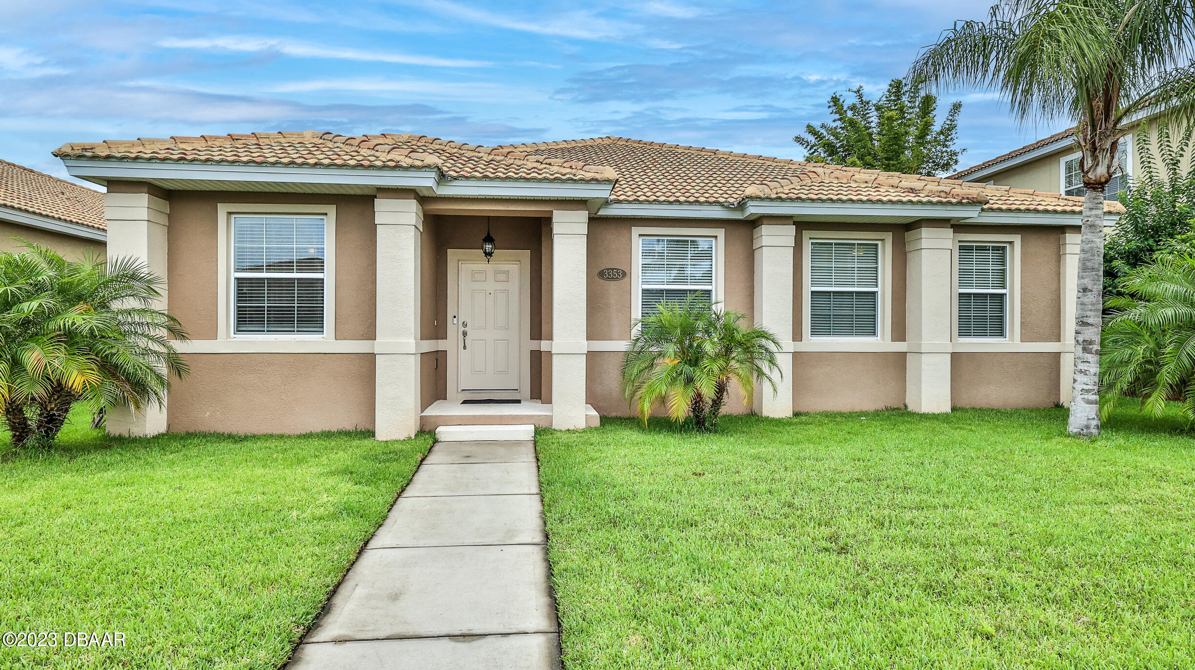 a front view of a house with a yard