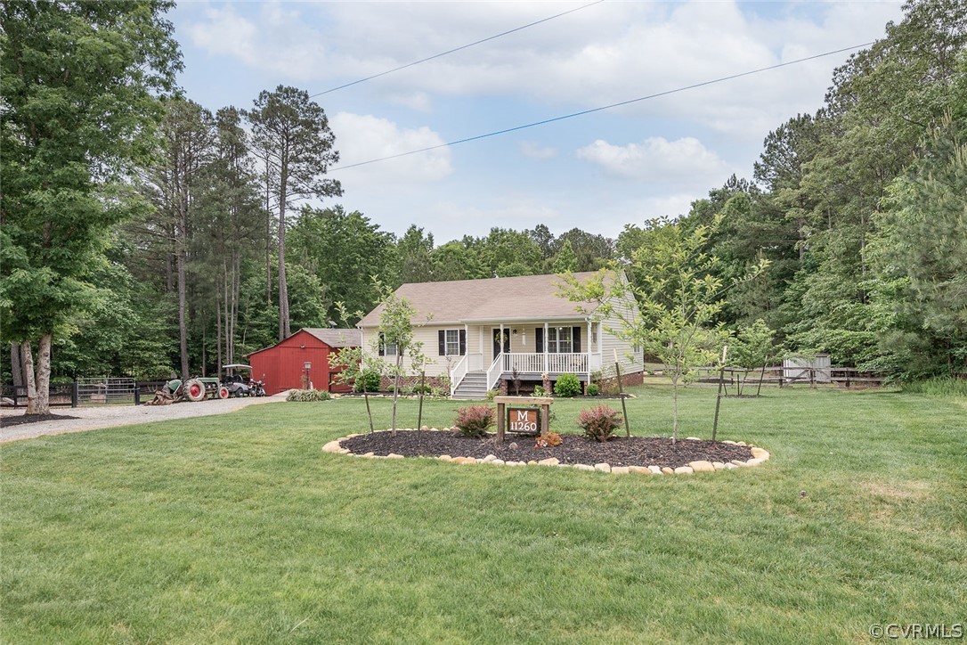 a view of a house with a yard