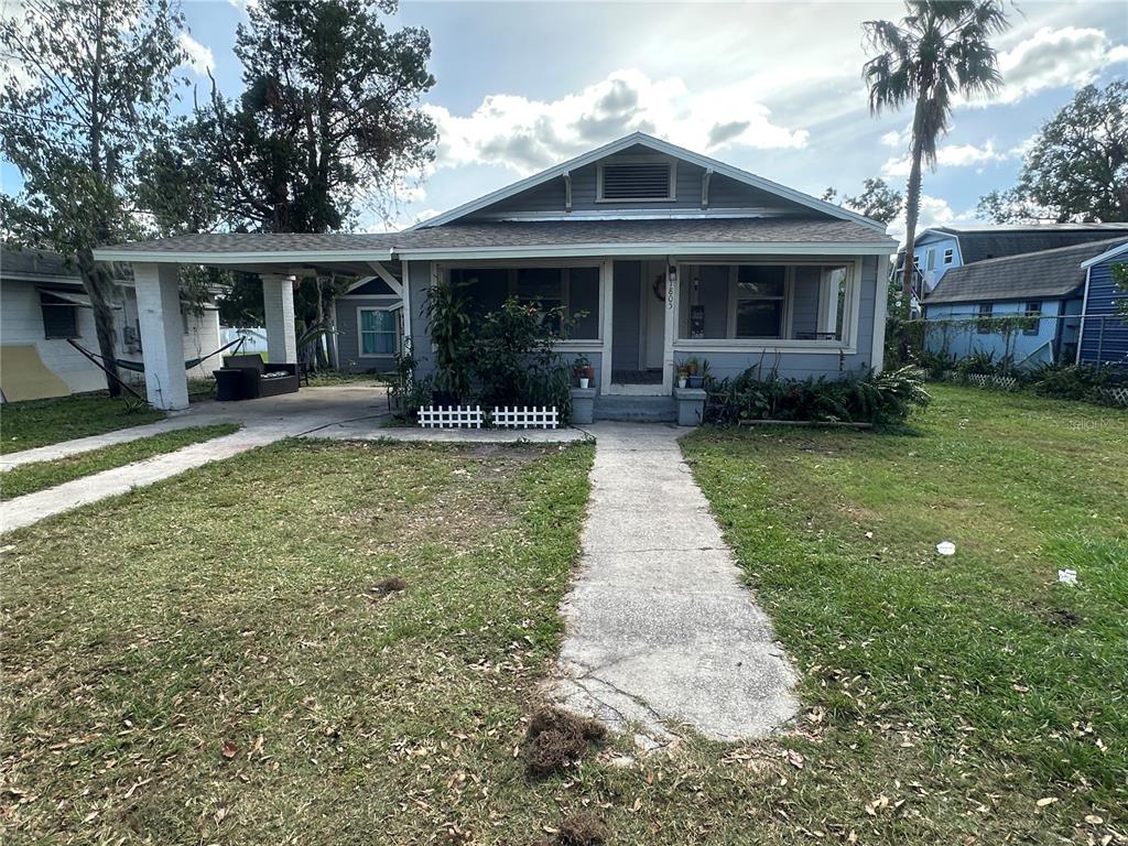 a front view of a house with a garden and porch