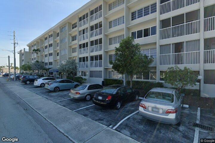 a view of a cars parked in front of a building