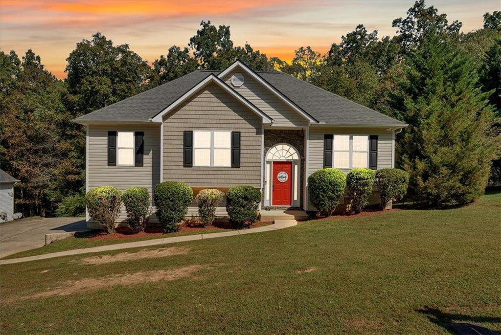 a front view of a house with a yard