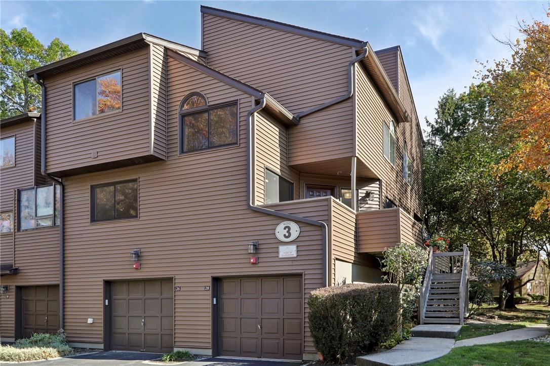 View of building exterior with a garage