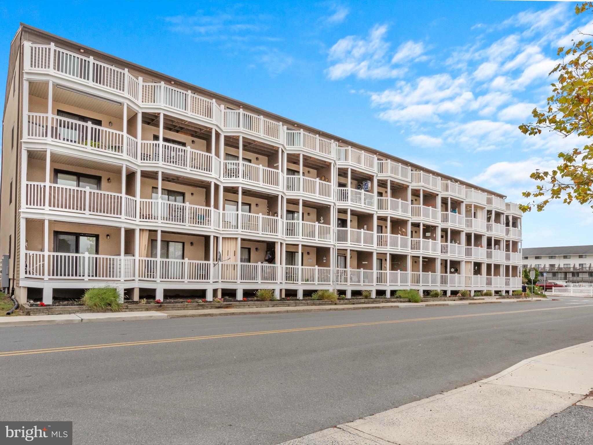 a tall building sitting on the side of a street