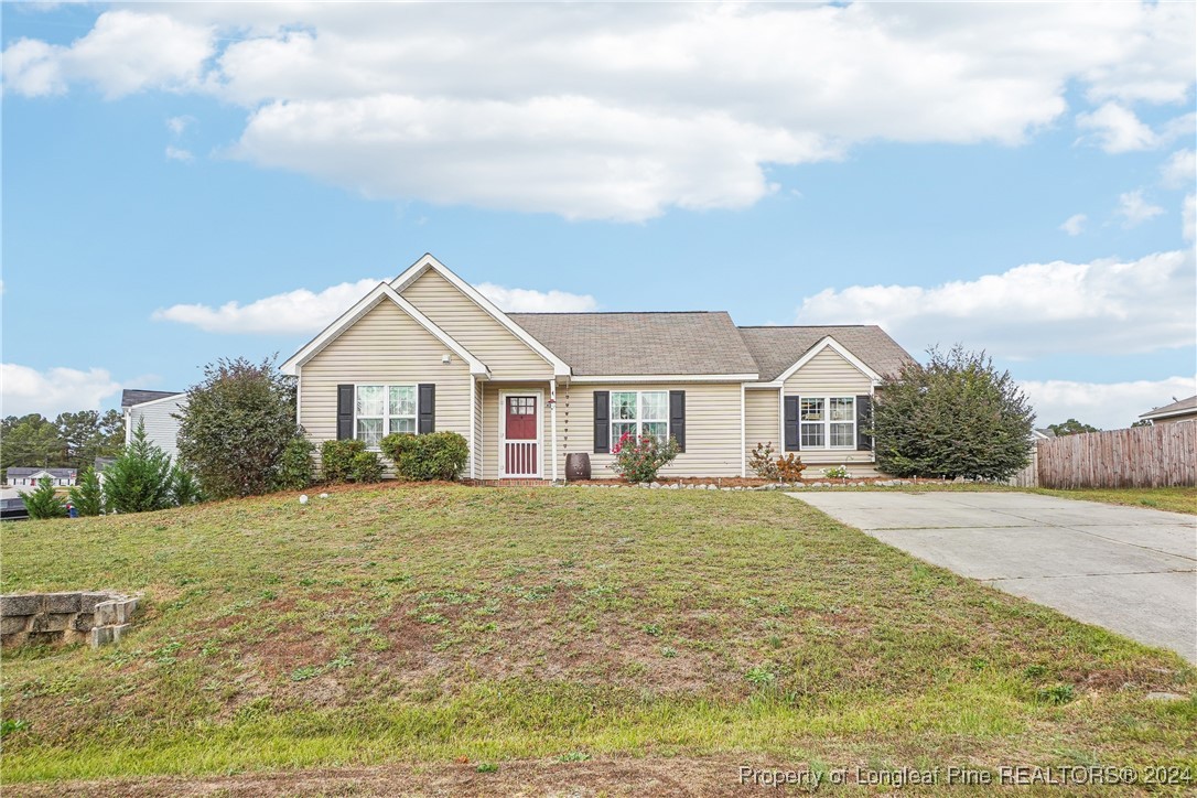 a front view of a house with a yard