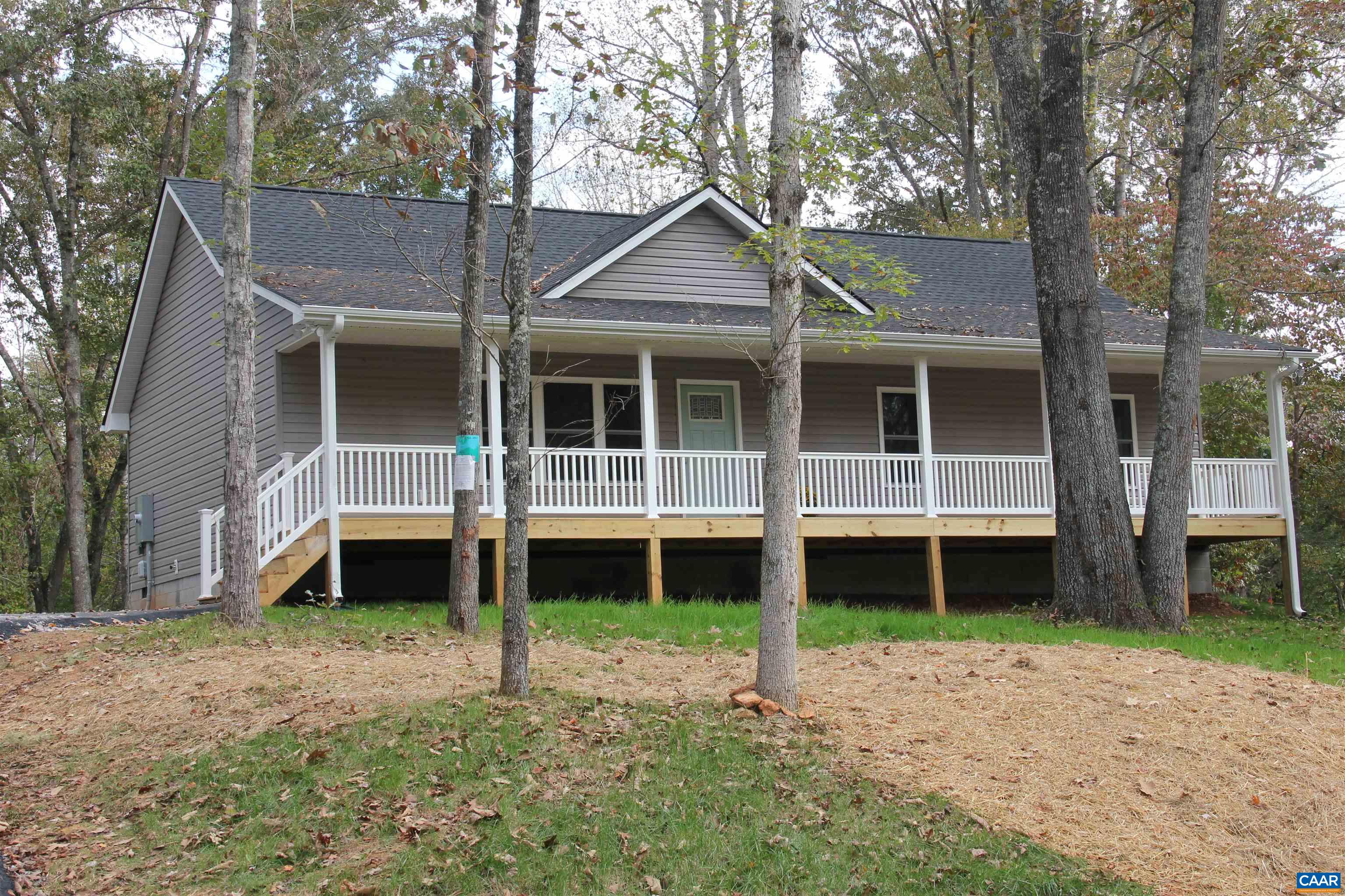 a house with trees in the background