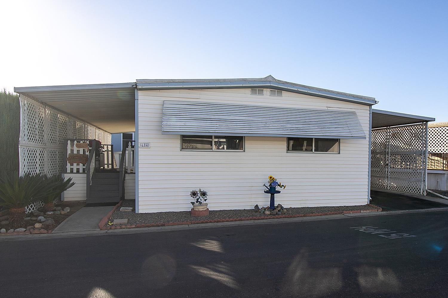 a front view of a house with yard