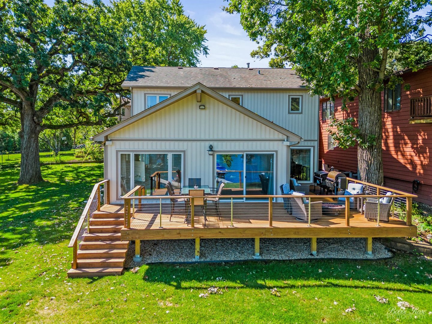 a view of a house with a yard patio and swimming pool