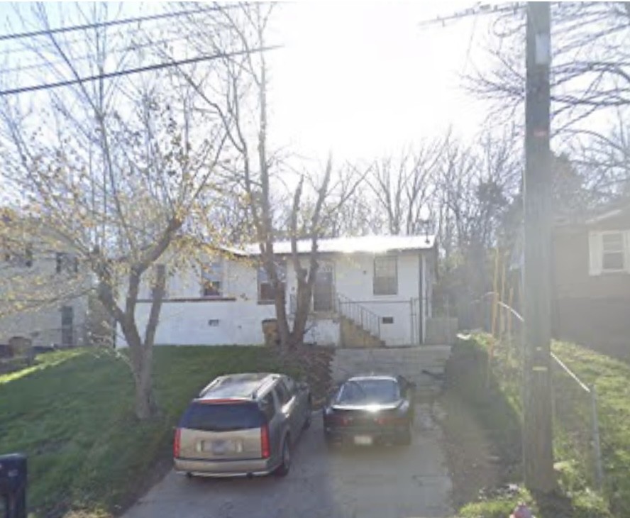 a car parked in front of a house