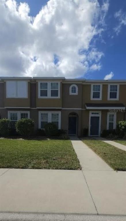 a front view of a house with a yard