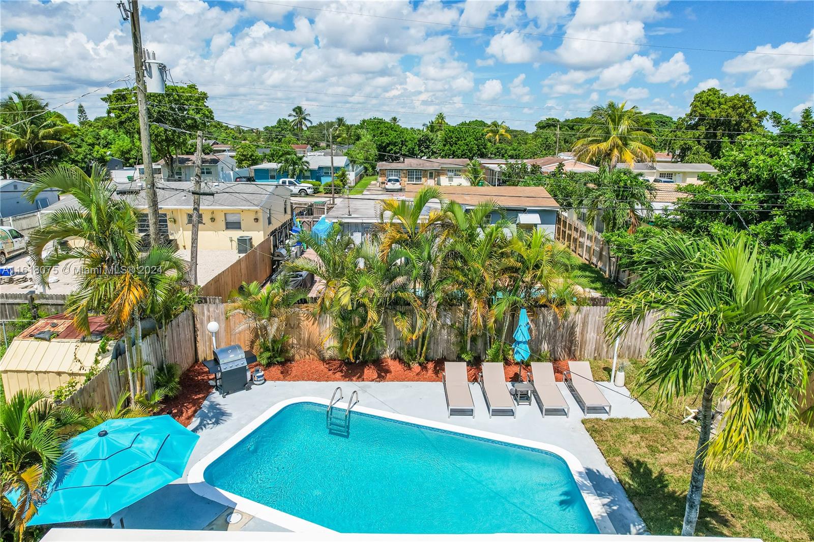 a view of a yard with swimming pool