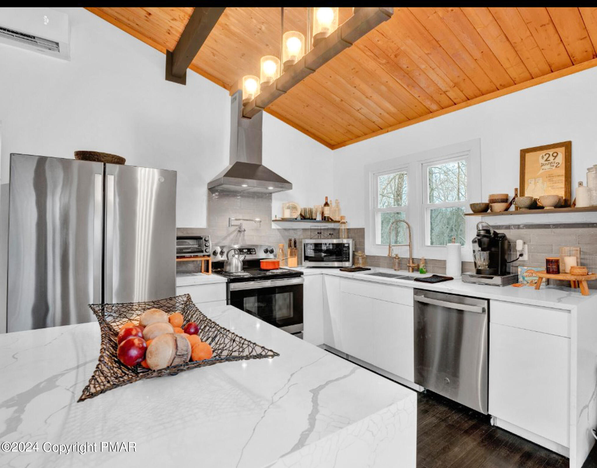 a kitchen that has a lot of cabinets and refrigerator