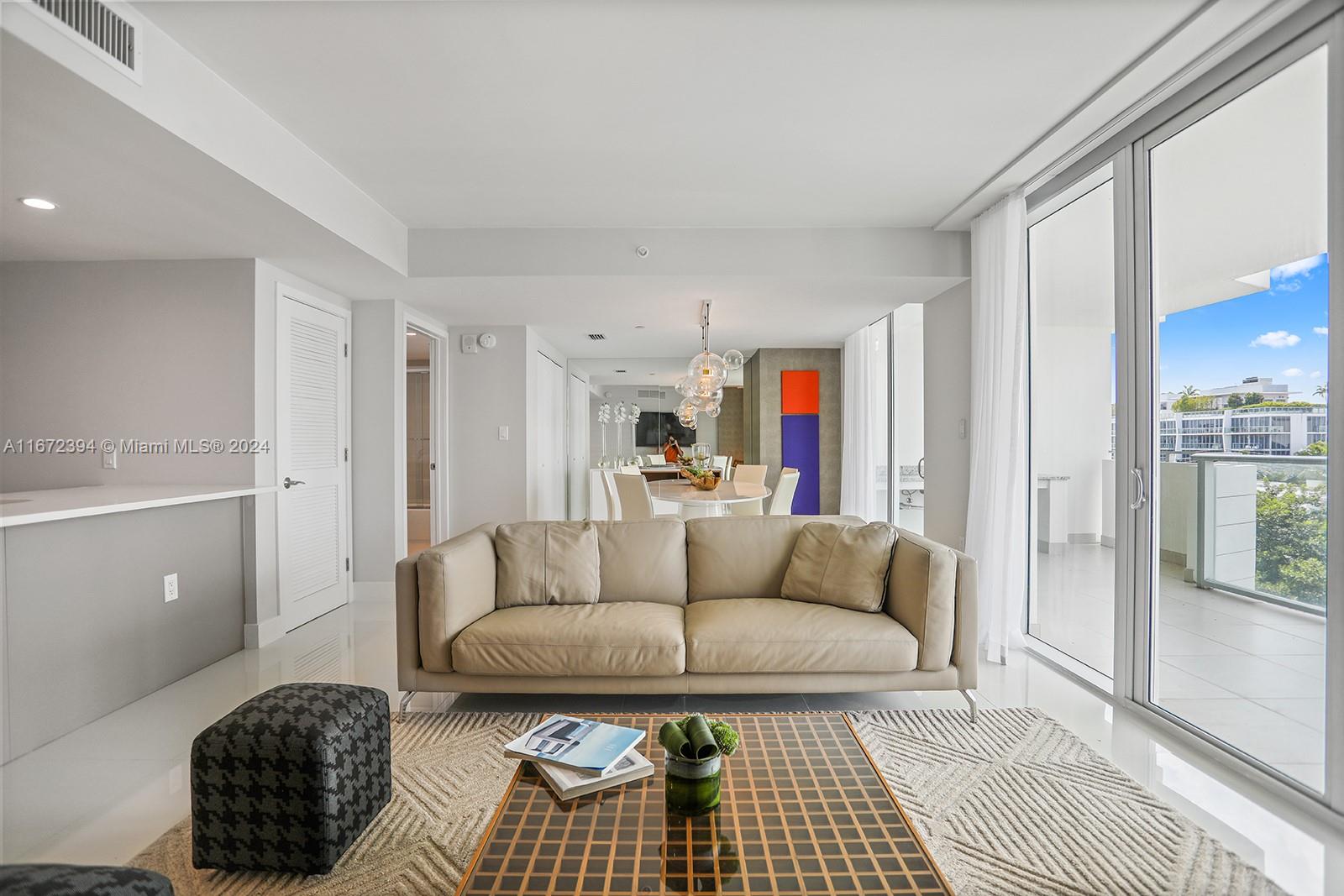 a living room with furniture and a rug