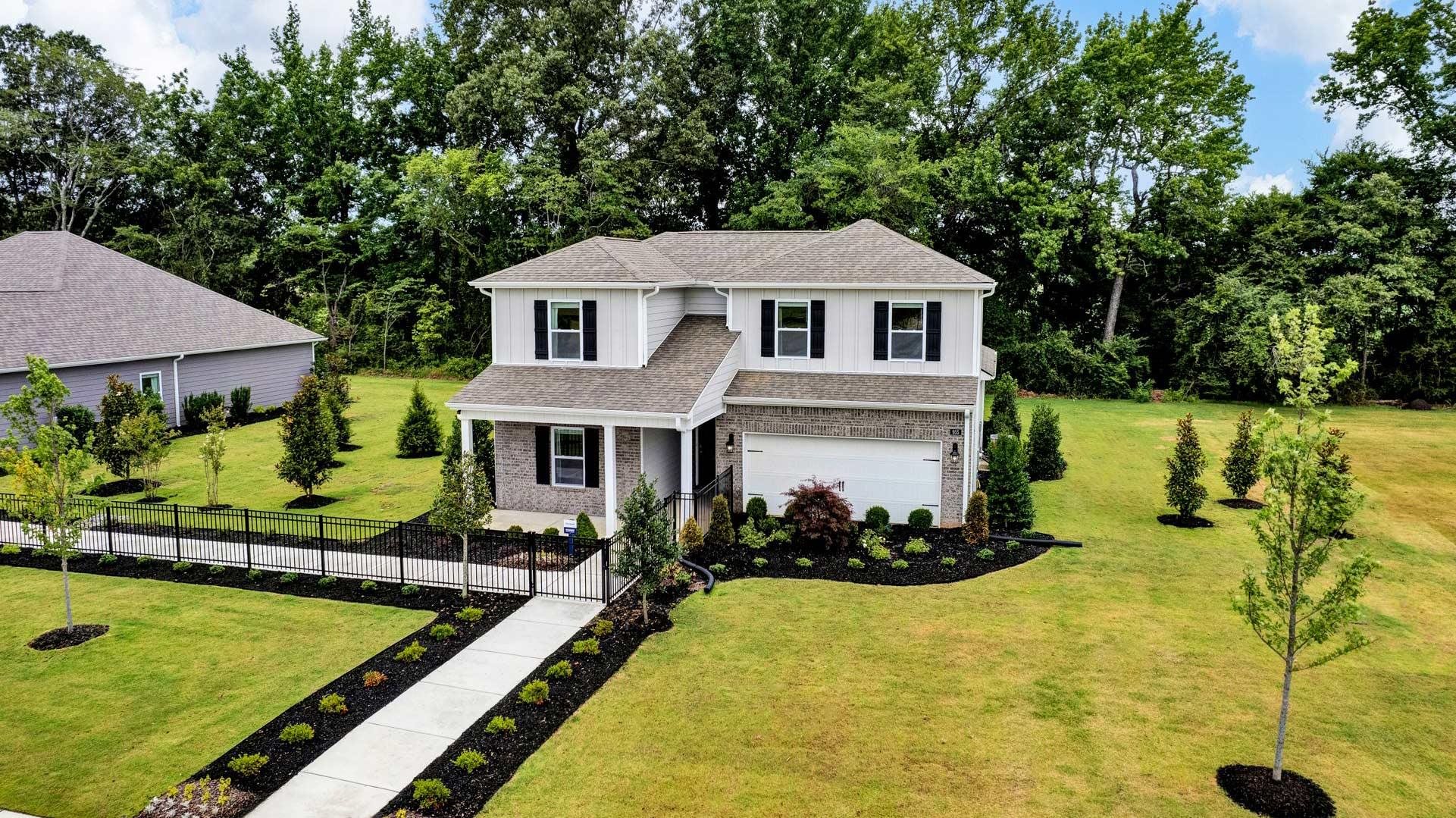 a front view of a house with a yard