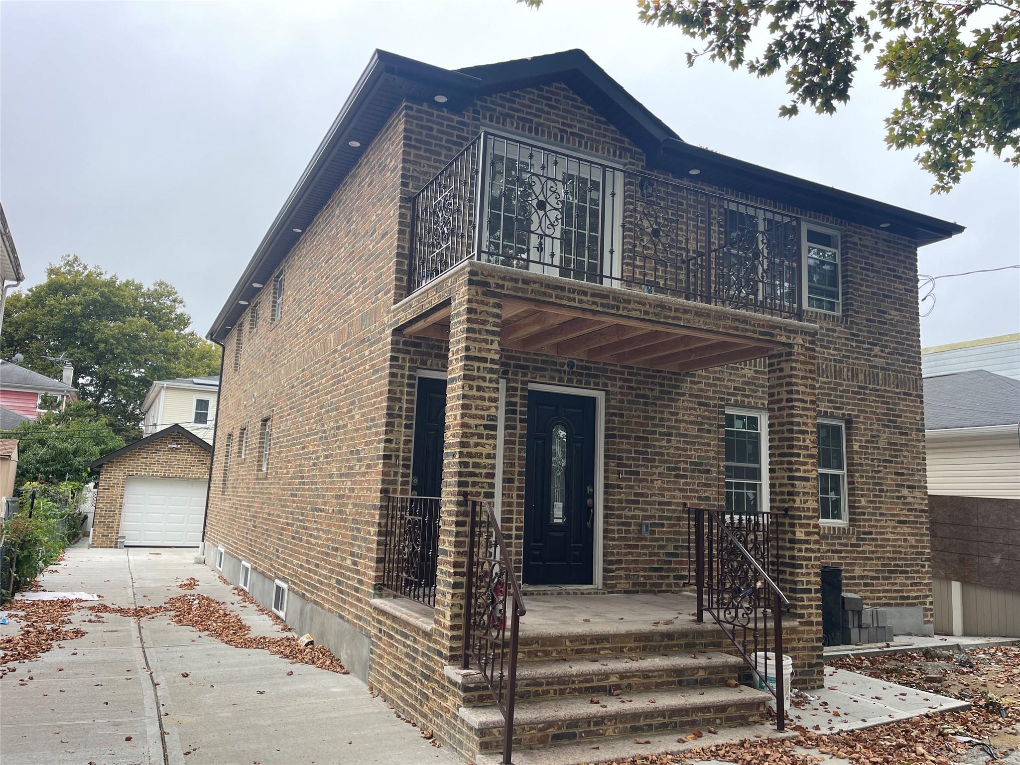 a front view of a house with stairs