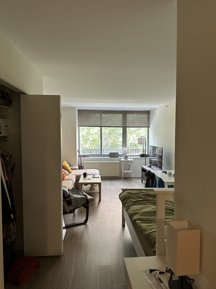 a living room with furniture and a large window