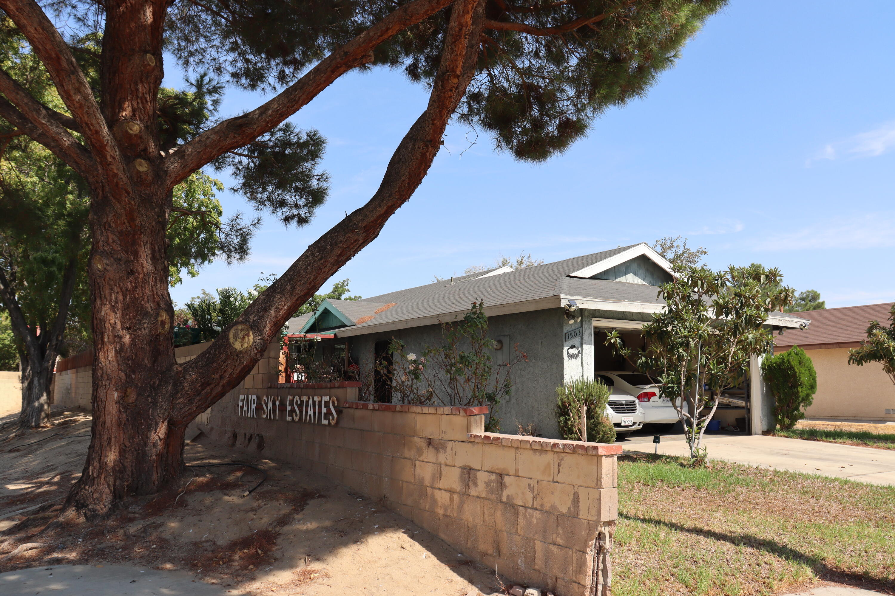 a view of a house with backyard porch and sitting area