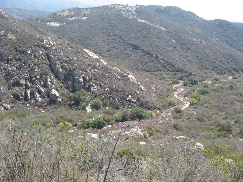 a view of mountain view with lots of trees