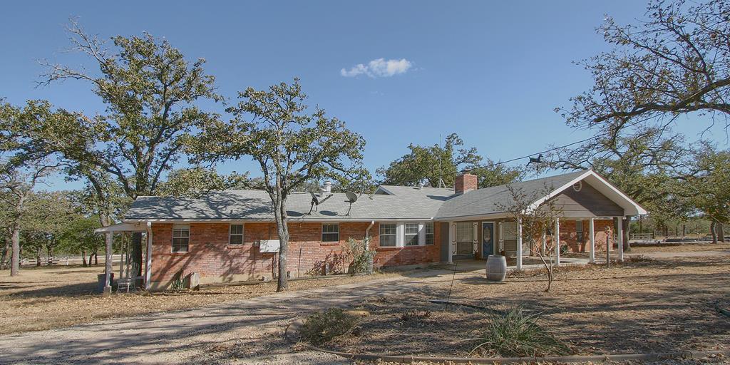 a view of house with trees in the background