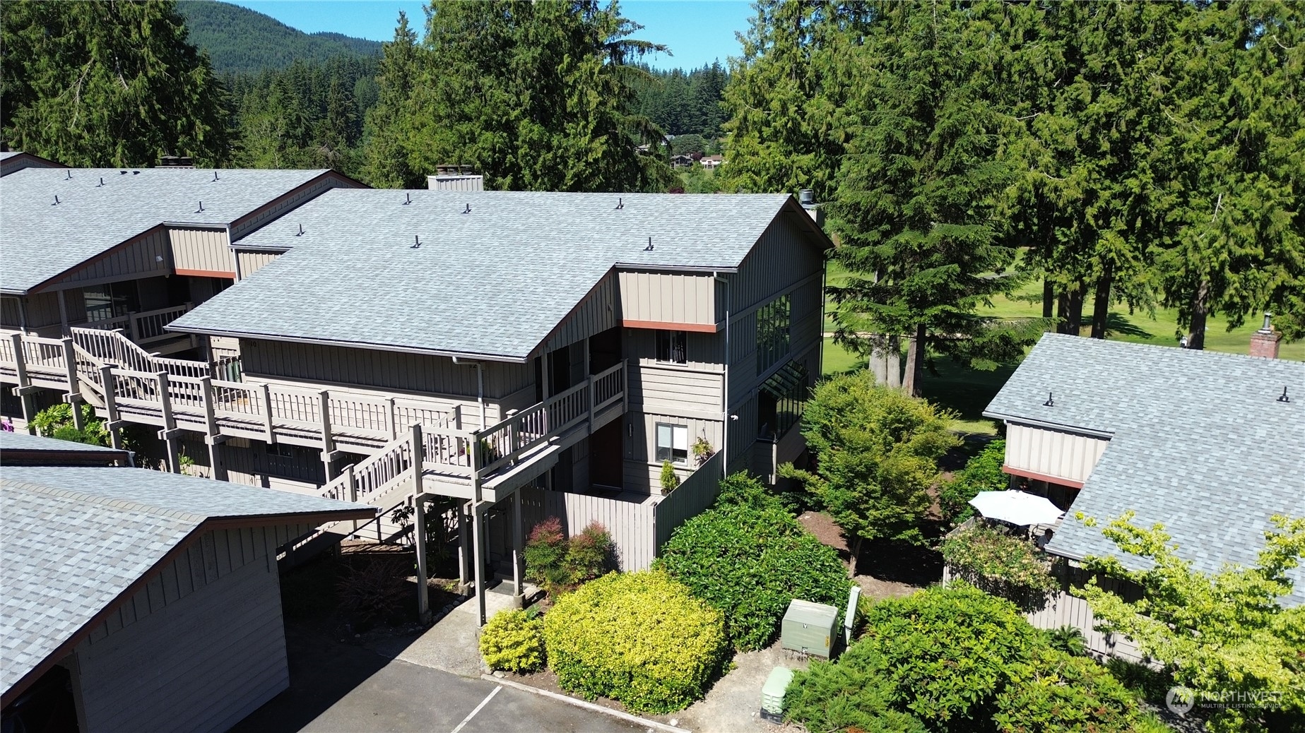 an aerial view of a house with a yard